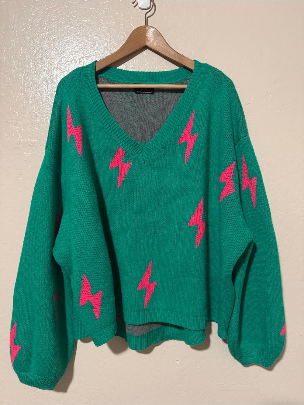 Dressed in LALA Green V-Neck Sweater with Pink Lightning Bolt Oversized Sweater